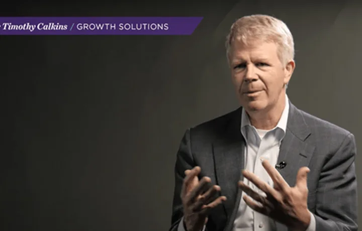 Still from the video series — Professor Timothy Calkins speaking to camera under a purple “Growth Solutions” title bar.