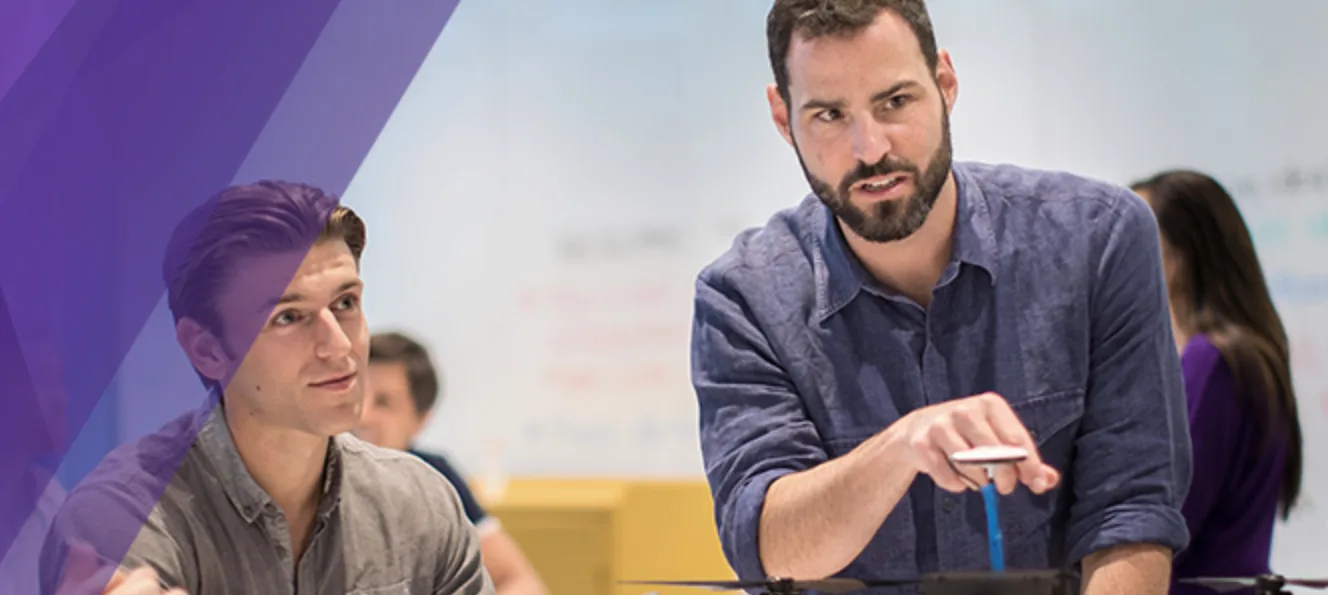 Hero image from the consolidated Kellogg innovation and entrepreneurship website — a purple diagonal overlay beside a photograph of a bearded instructor demonstrating with a small drone as students look on.